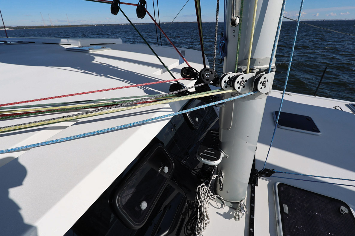 All halyards come back to the helm station, whether from the headsails or from the mast step.