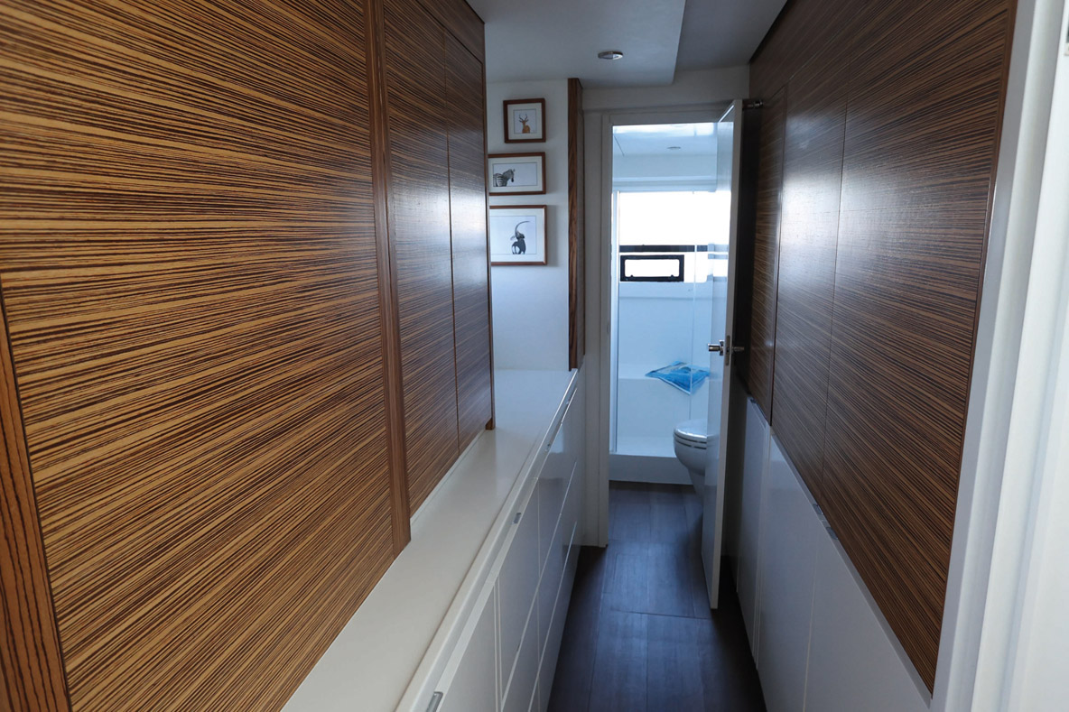 On the starboard side, the owner’s suite features a Queen size bed, a walk-in closet, a huge bathroom and storage space throughout the corridor.
