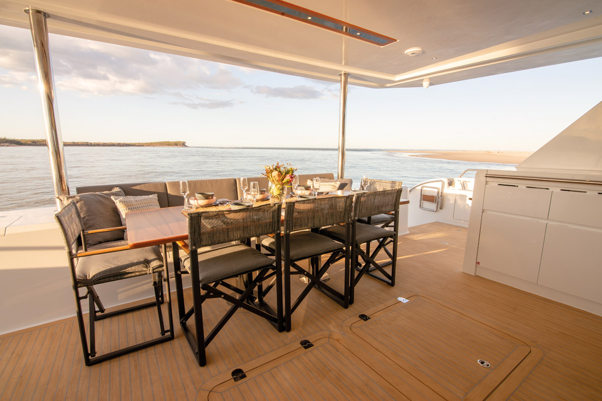 The aft cockpit is sheltered, and the outside diners are right beside the galley for convenience; and large wetbar with barbecue completes this functional area. Lower down, the lower hydraulic platform serves as both a private beach…  and as a passerelle.