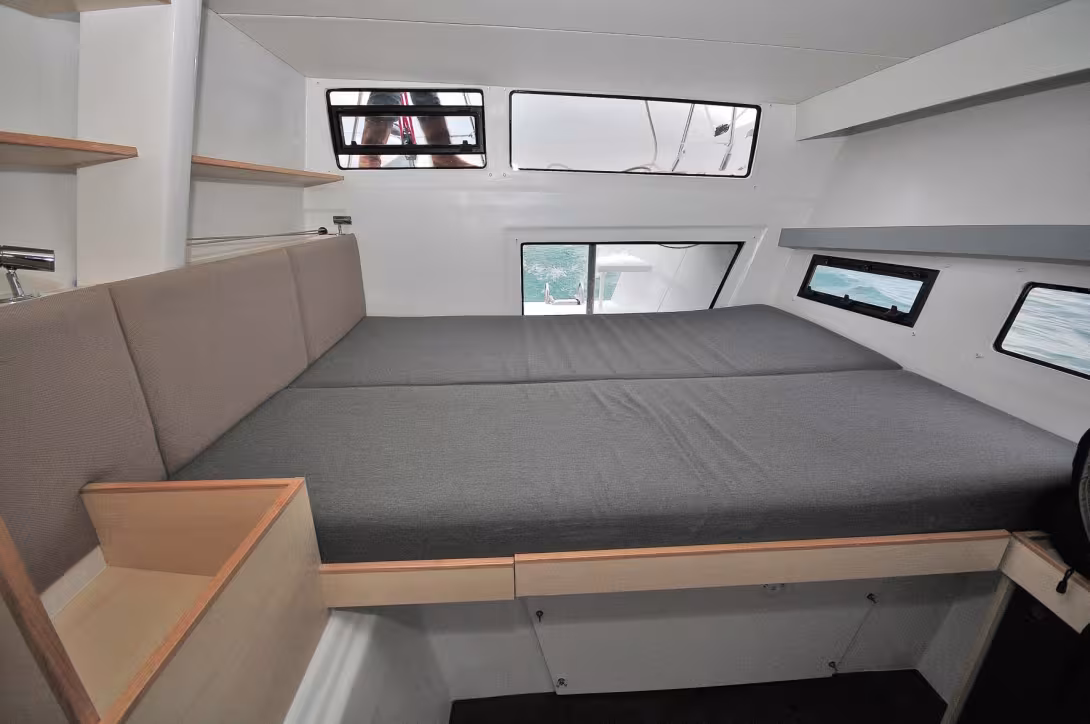 Feng Shui-inspired aft cabins with remarkable volume and light!  Note the access to the motors and the routing of the fiber lines from the helm behind the hatch on the left